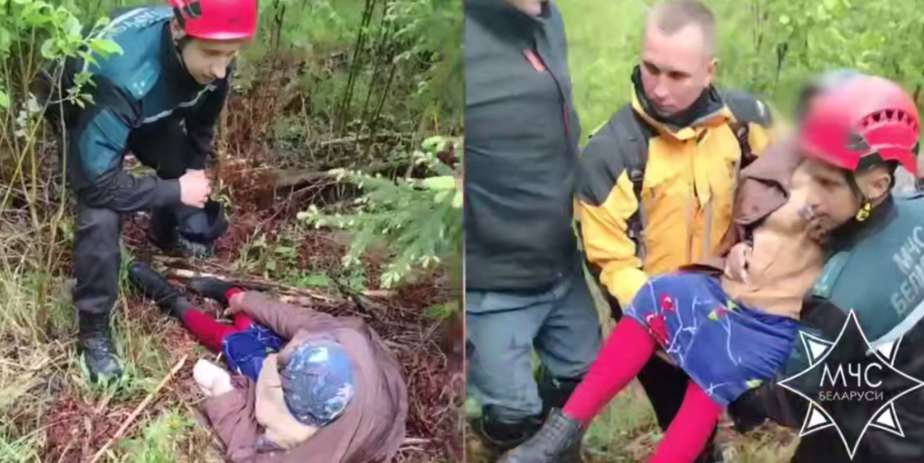 спасатели выносят из леса потерявшуюся женщину